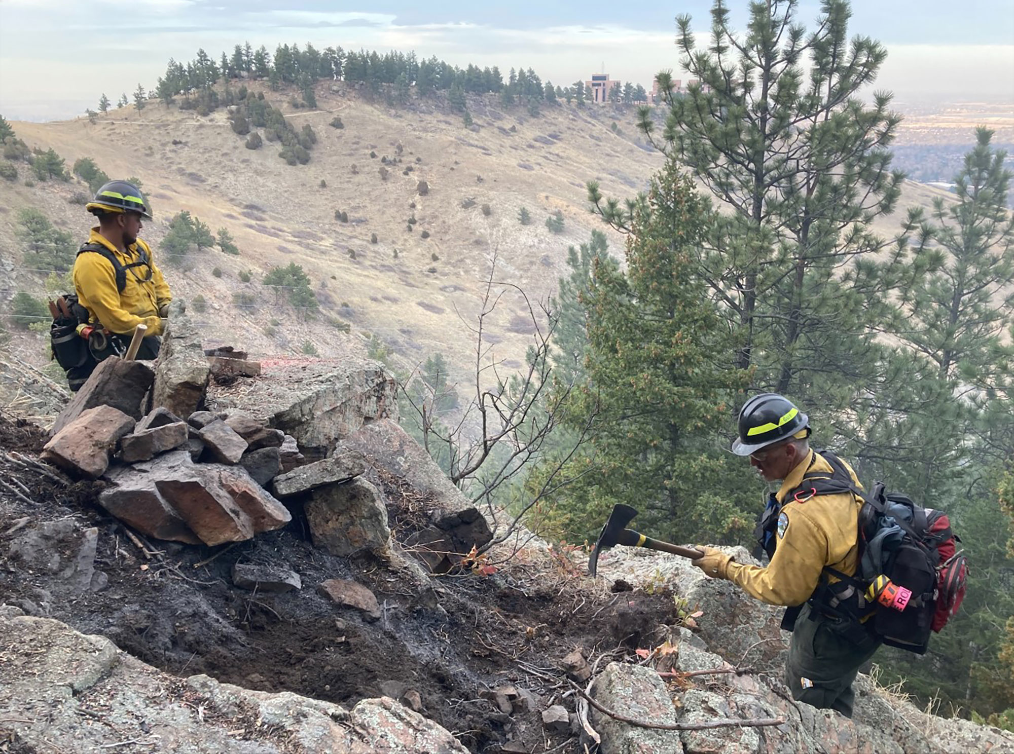 Firefighters working on OSMP land near NOAA