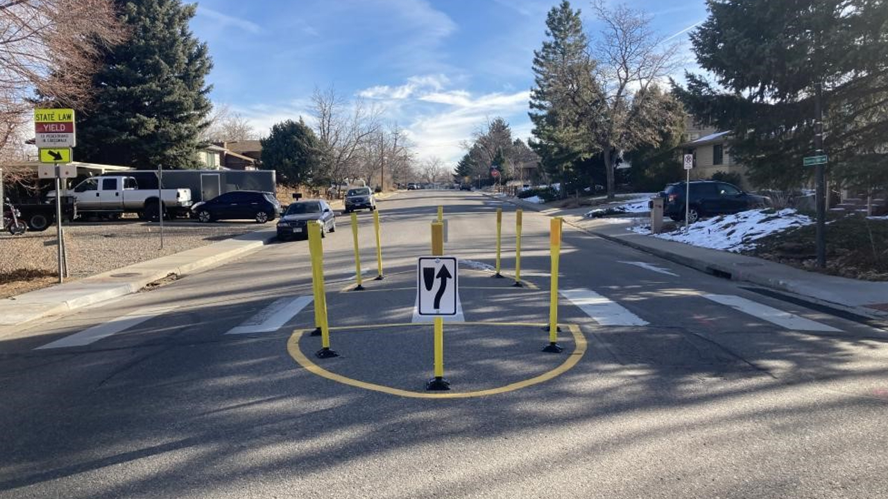 a median with yellow posts 