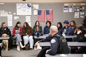 Seven YOAB Members sitting in on a Police debriefing. 