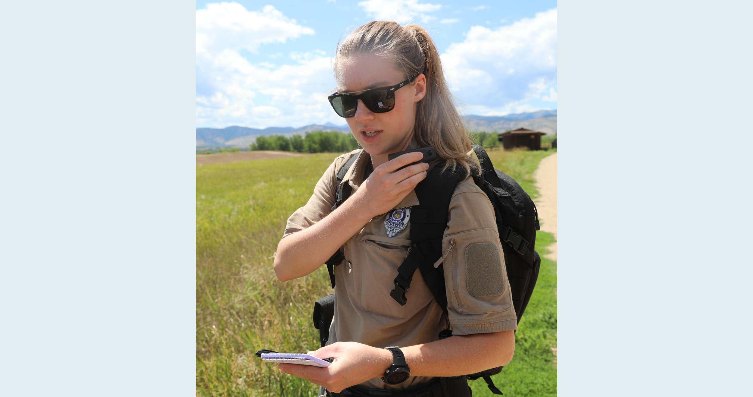 A BPR Ranger writing a citation and speaking into the radio