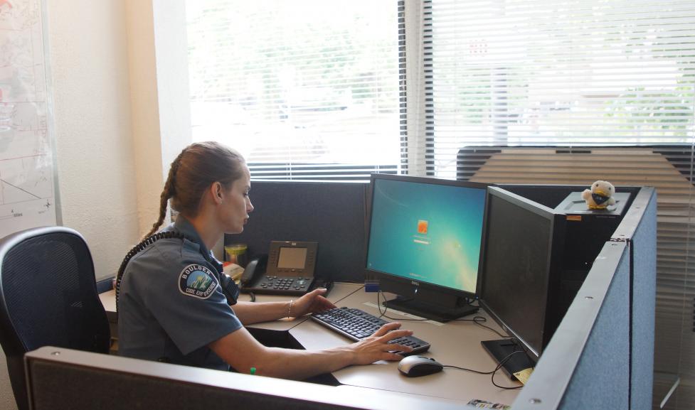 Boulder police officer at computer