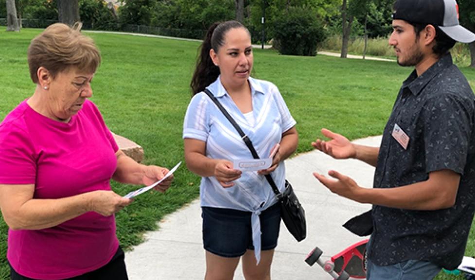 Community members speak outside