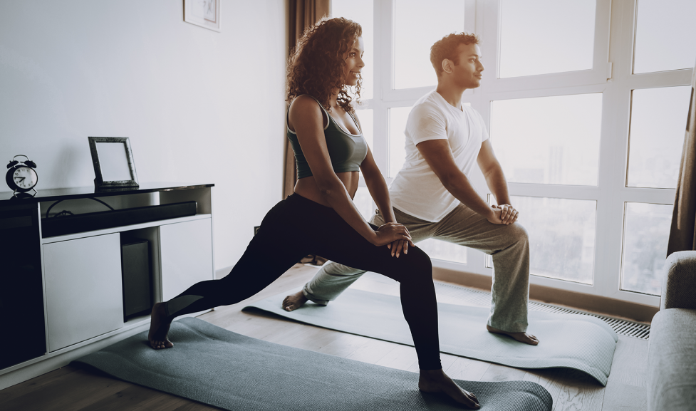 Two people participating in virtual fitness