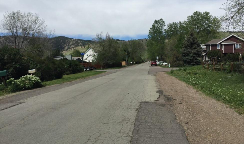 deteriorating pavement along Sumac Avenue with no sidewalk