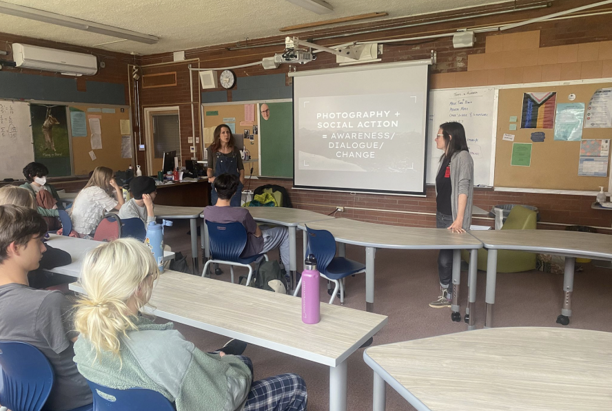 New Vista High School students learn about photovoice in a classroom