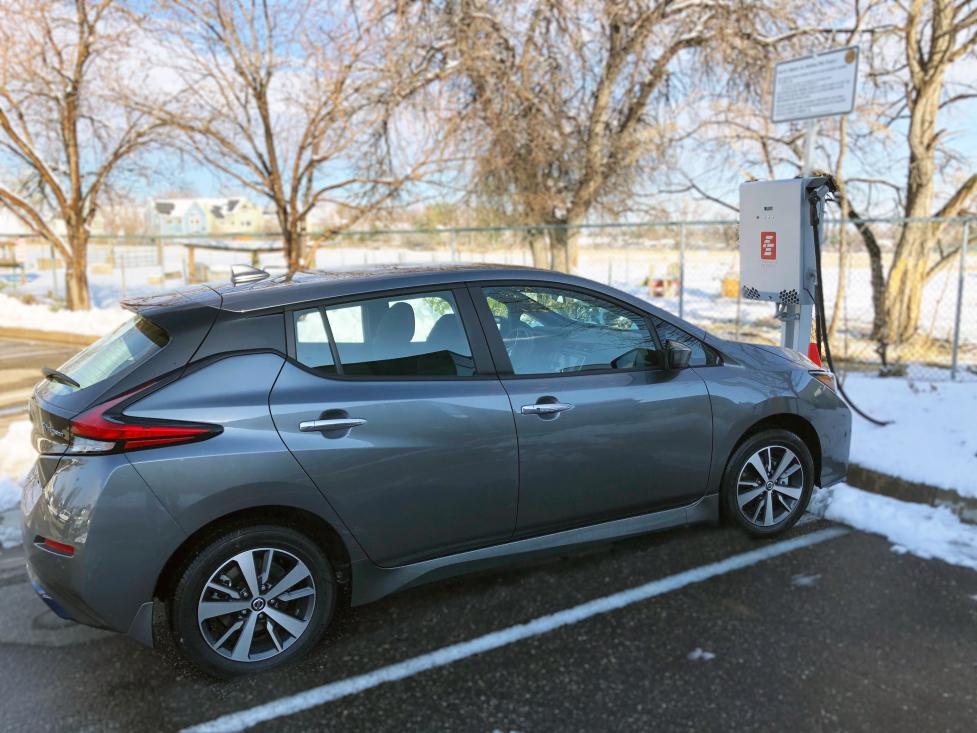 A grey Nissan Leaf is plugged into a bi-directional charger at the North Boulder Recreation Center