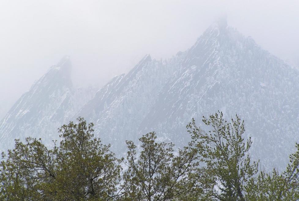 The Flatirons cloaked in smoke