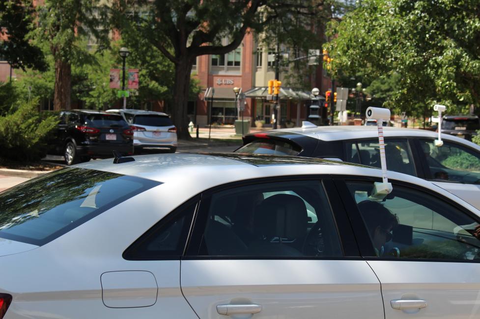 Two cars equipped with heat sensors during heat mapping event.