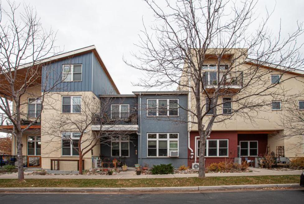 a row of multi-colored attached houses in Boulder