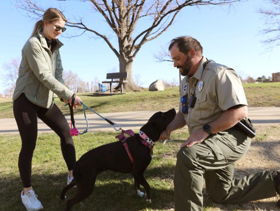 Urban Park Ranger meeting a dog