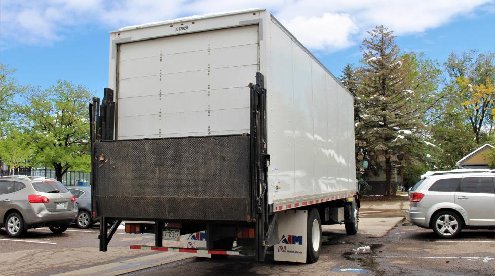 Moving truck in a community parking lot