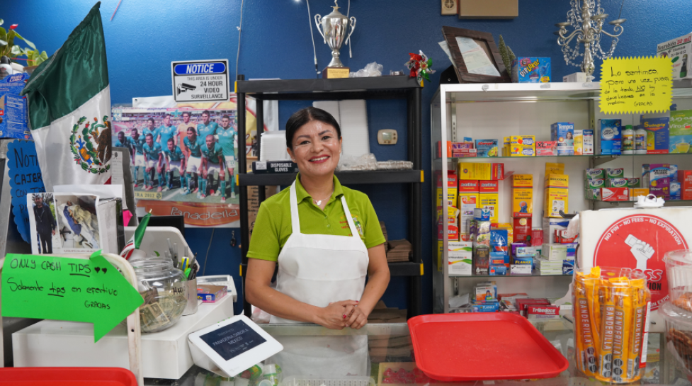 Ana Nieto poses in front of her business, Panaderia Sabor a Mexico