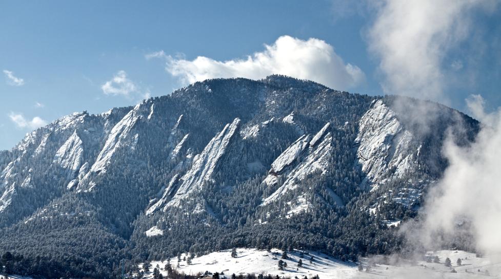 Boulder's flatirons covered in snow