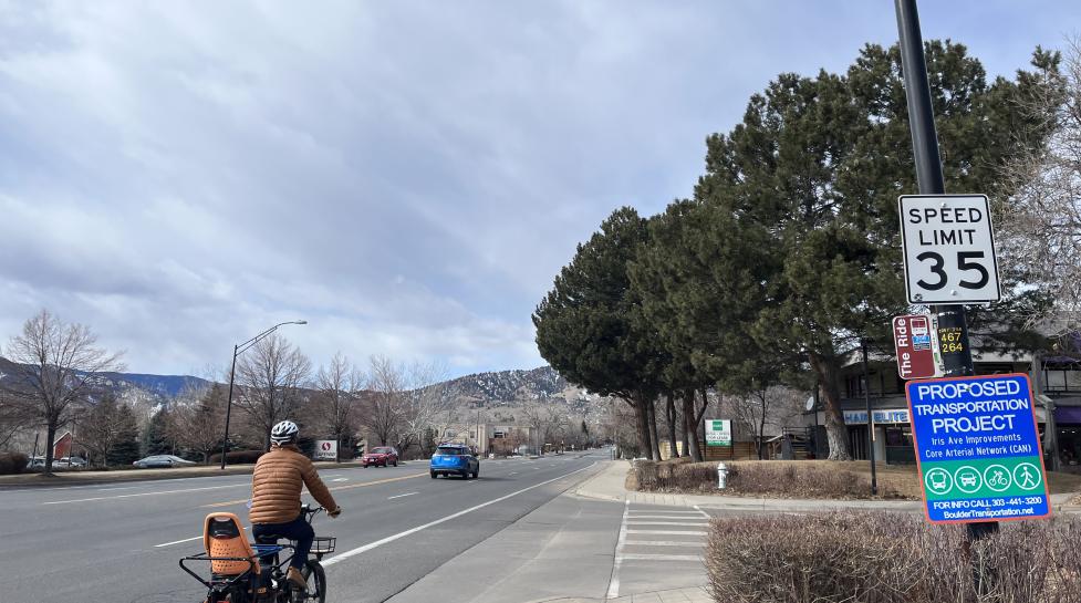 A person biking down Iris Avenue