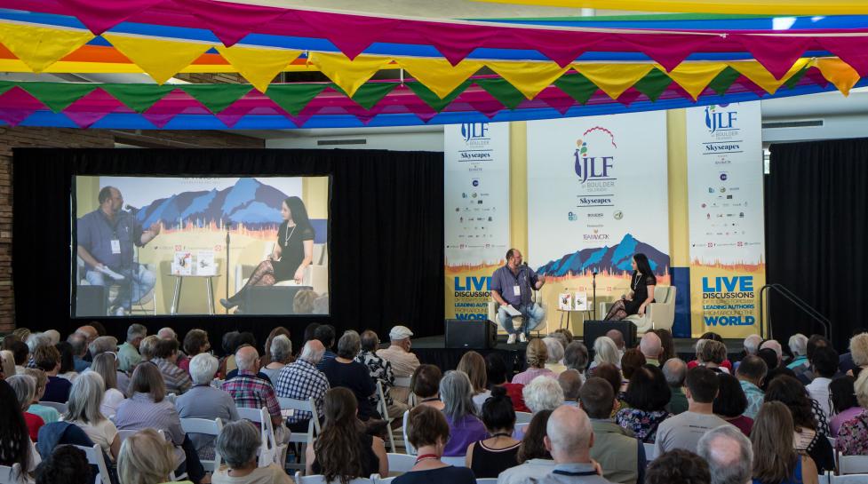 Speakers listening to presenters at JLF Colorado.