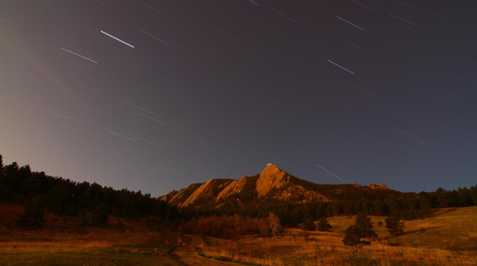 Boulder flatirons at night with a starry sky