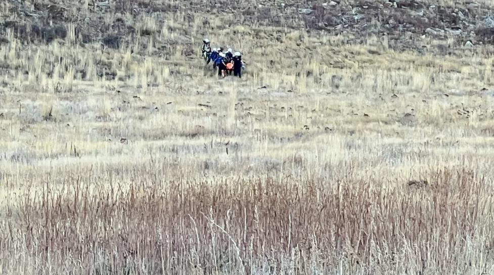 Boulder Fire Rescue and other first responders walking down a hill