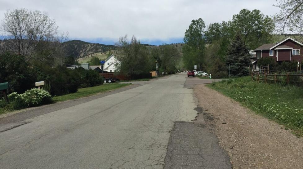 deteriorating pavement along Sumac Avenue with no sidewalk