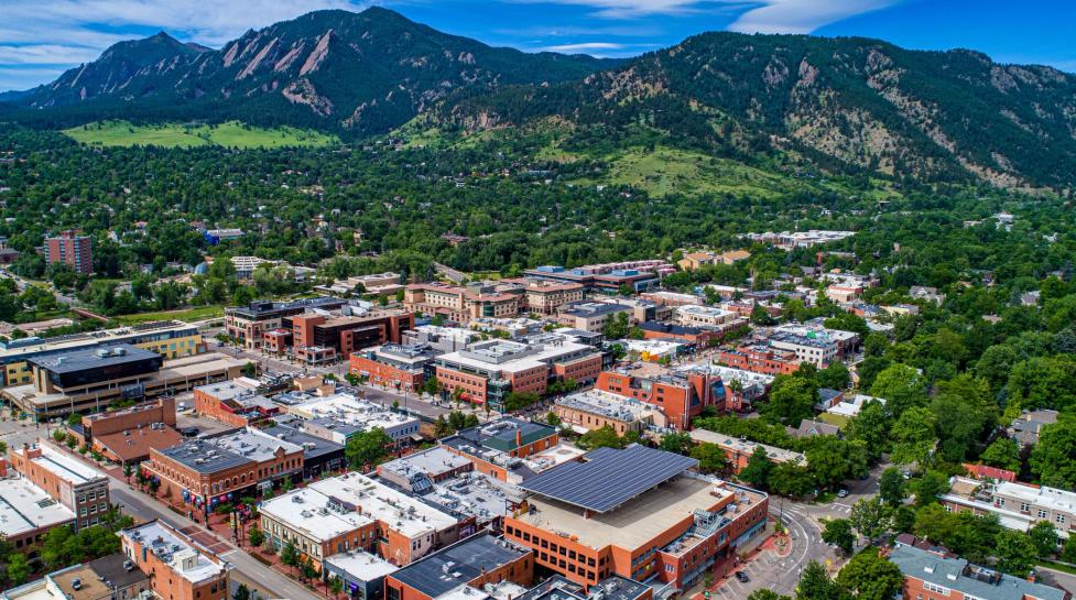 Aerial view of Boulder overlooking downtown area and the Flatirons