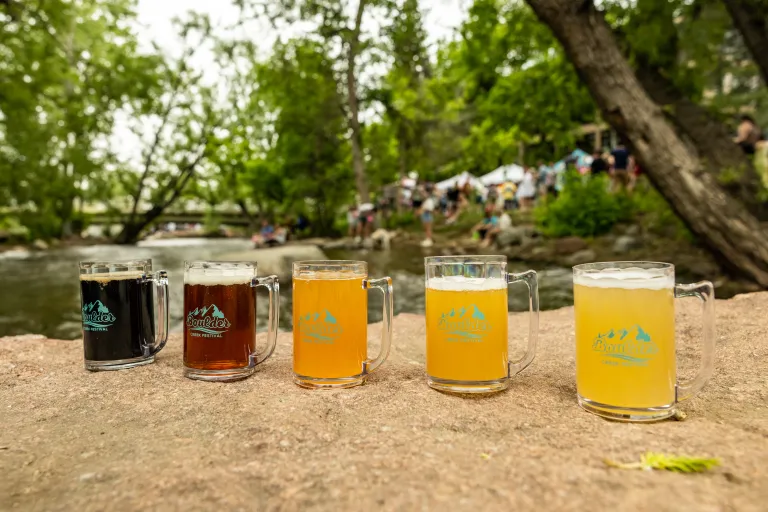 Mugs of beer lined up on the Boulder Creek