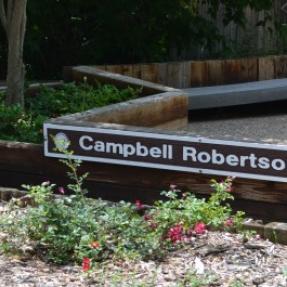 park sign and bushes