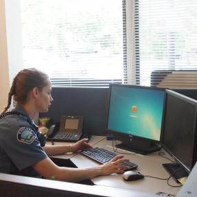 Boulder police officer at computer