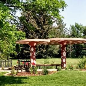 Colorful red with white dots shelter with garden and bridge