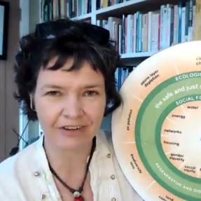 Photo of a woman holding a circular chart