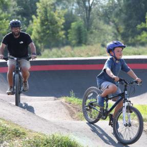 Father and son riding bikes