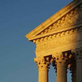 The sun sets on a corner of the supreme court building in Washington DC