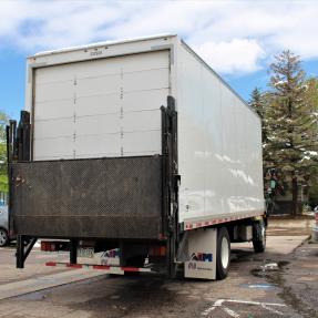 Moving truck in a community parking lot