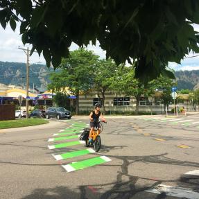 Person riding an e-bike on a Neighborhood GreenStreet