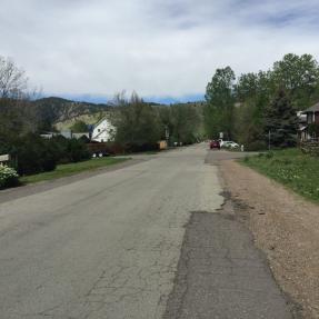 deteriorating pavement along Sumac Avenue with no sidewalk