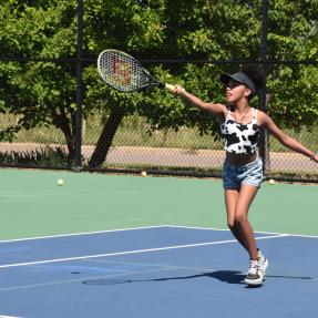 Girl playing tennis at East Boulder Community Center