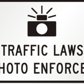 Traffic sign with words Traffic Laws Photo Enforced 