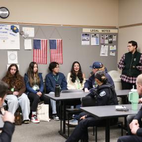 Youth and police officers meet during a briefing