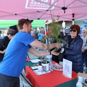 Community member receiving tree seedling