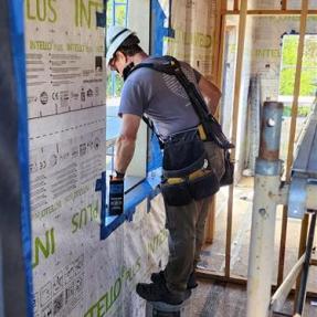 Kurt doing construction at a Habitat for Humanity build.