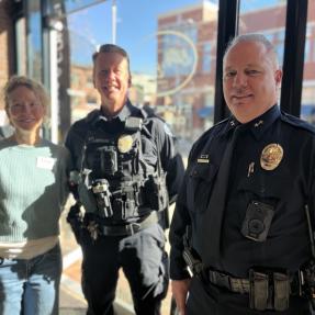 Boulder Police offers smiling for the camera at a past Coffee with a Cop event