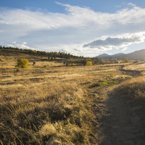 Sun comes over the land and spills across Marshall Mesa