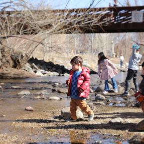 Kids playing in Boulder Creek in the Civic Area park