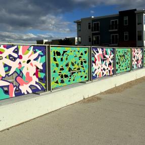 Photo of Broadway Ave. overpass with Sharon Dowell's art on the bridge railings