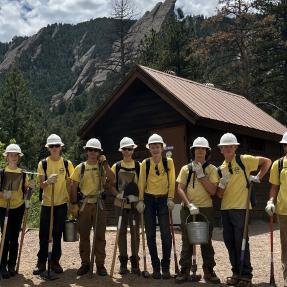 Junior Ranger crew poses in front of Flatirons